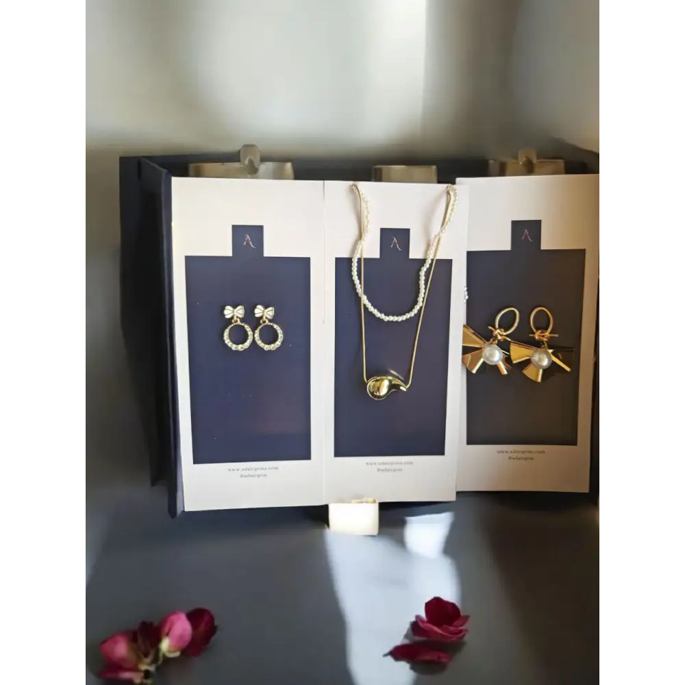 Luxury pearl and gold jewellery gift hamper with earrings and necklace in elegant packaging by Adair Gems.