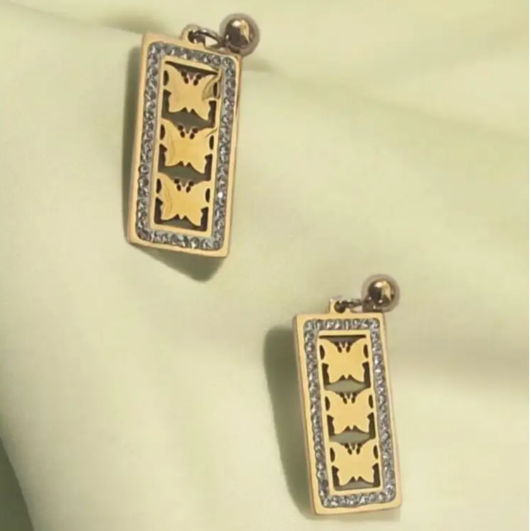 Elegant gold-plated butterfly earrings with a cutout design and crystal accents, perfect for adding a delicate charm to any outfit