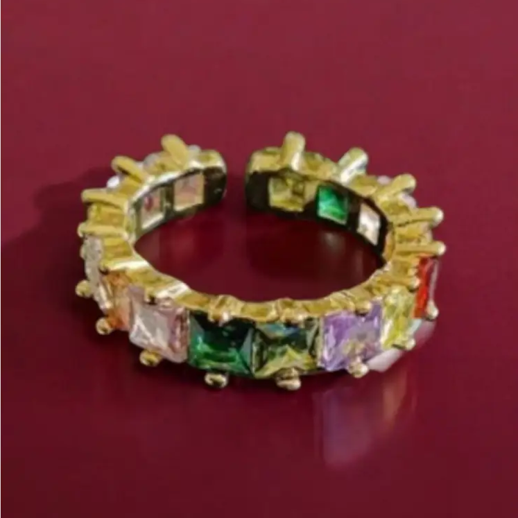 Gold-plated open ring with multicolor square gemstones, featuring an adjustable fit and vibrant hues, perfect for modern statement jewelry lovers